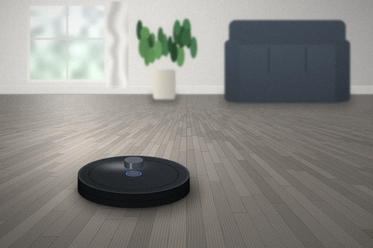 Robot vacuum moving across a grey wooden floor in front of a sofa and plant