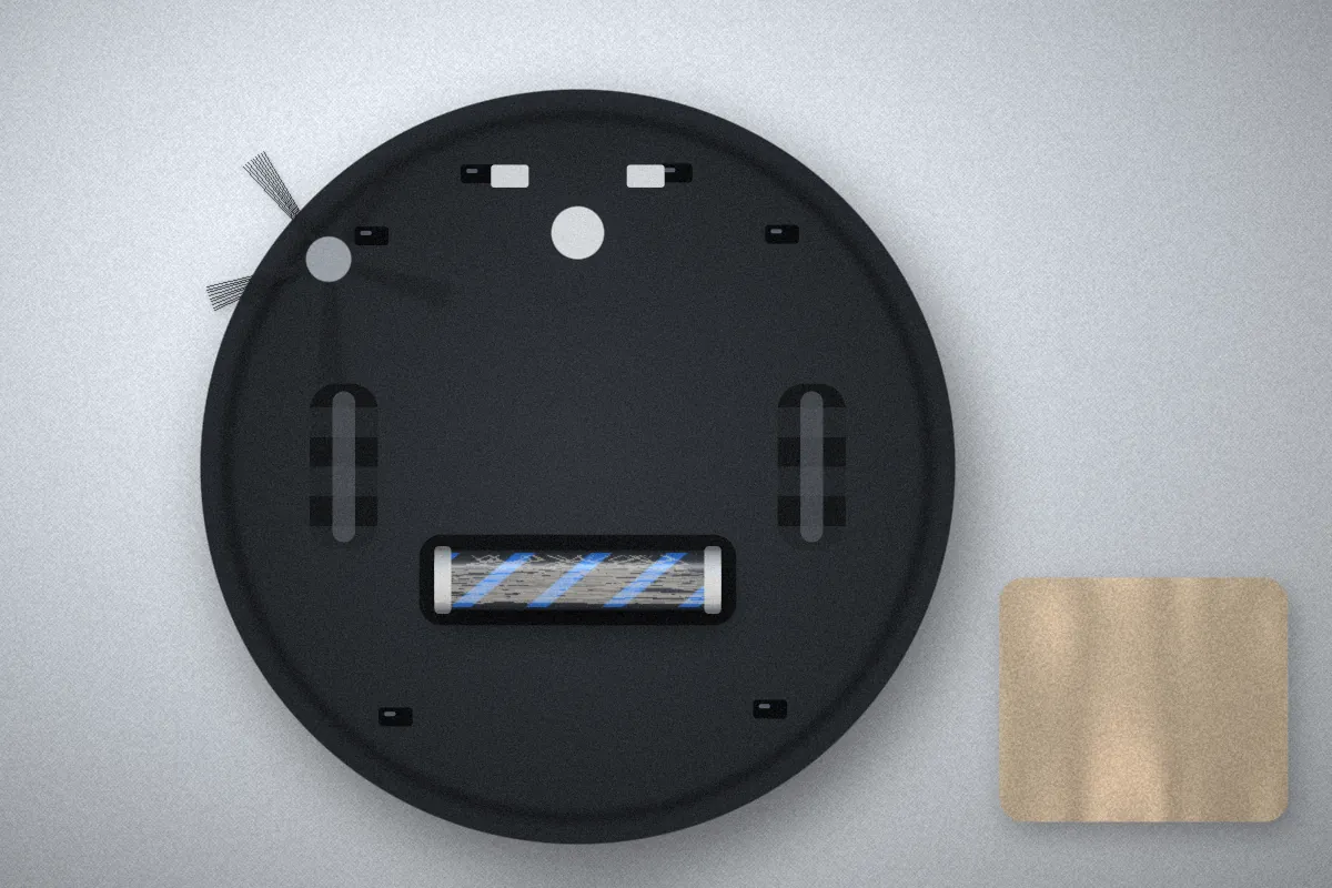 Underside of a robot vacuum showing small sensor windows near the edge, beside a soft cloth